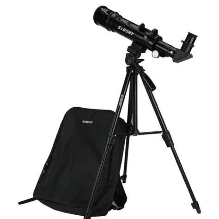 A black telescope next to a black bag
