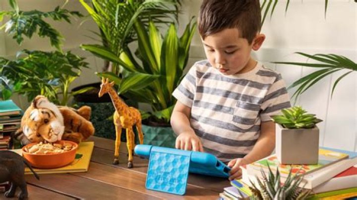 Child playing with Amazon Fire 7 Kids edition tablet Child playing with Amazon Fire 7 Kids edition tablet