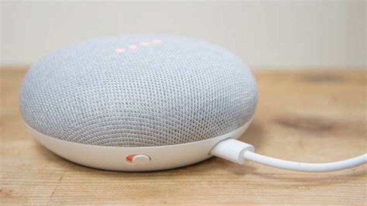 Google Home Mini and Max Hands On-2 Google Home Mini on a table - free smart speaker with Spotify Family promo