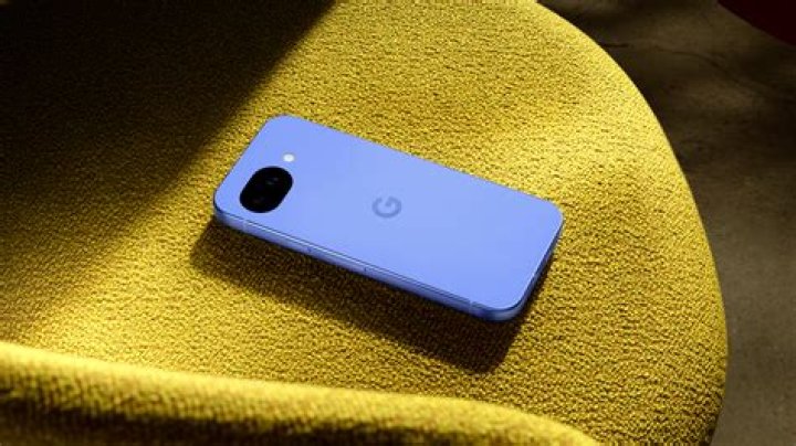 Google Pixel 4a holding phone back Google Pixel 4a holding phone back