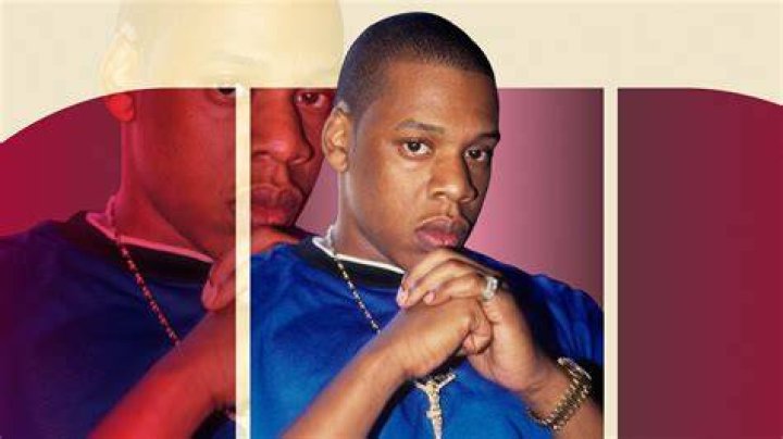 Jay-Z poses in a blue shirt in 1996