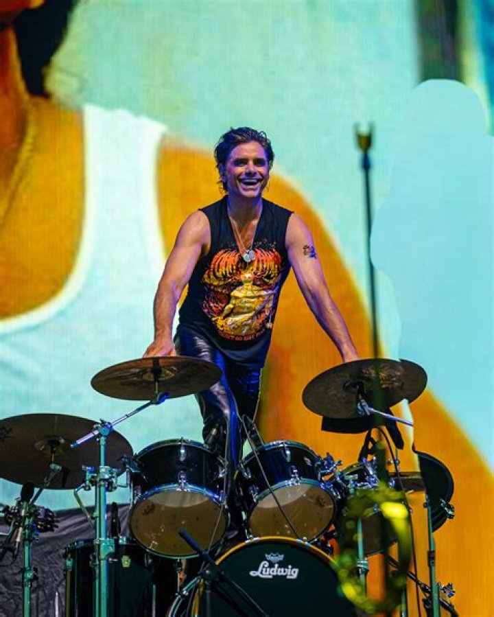 John Stamos performing 