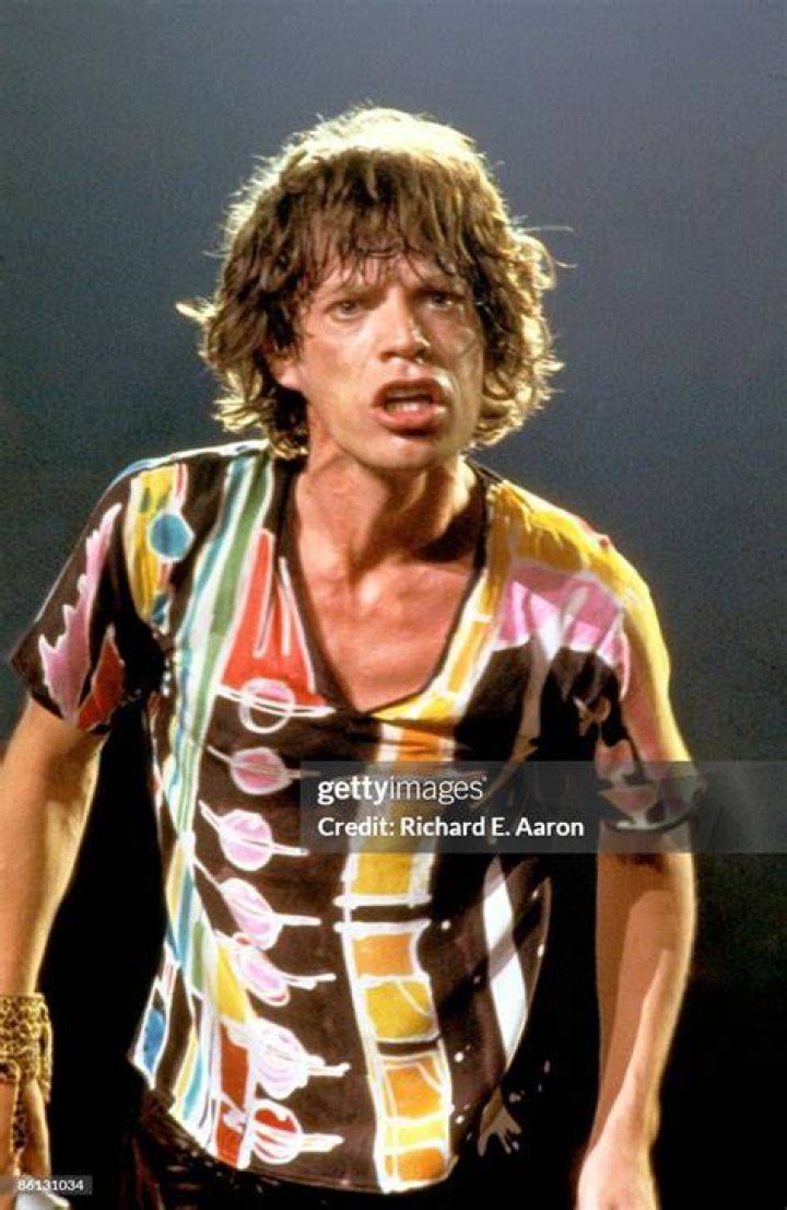 Mick Jagger performing on stage Mick Jagger performing on stage