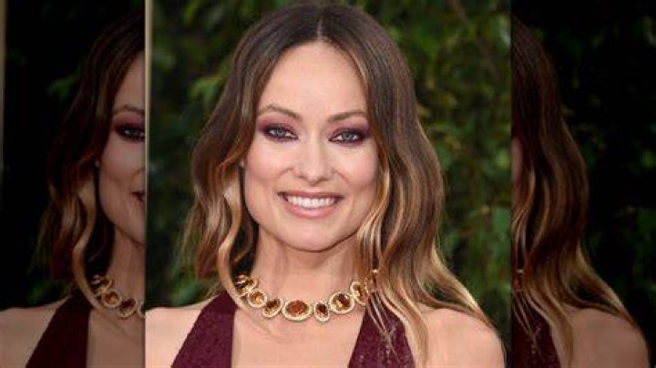 Olivia Wilde smiling at event