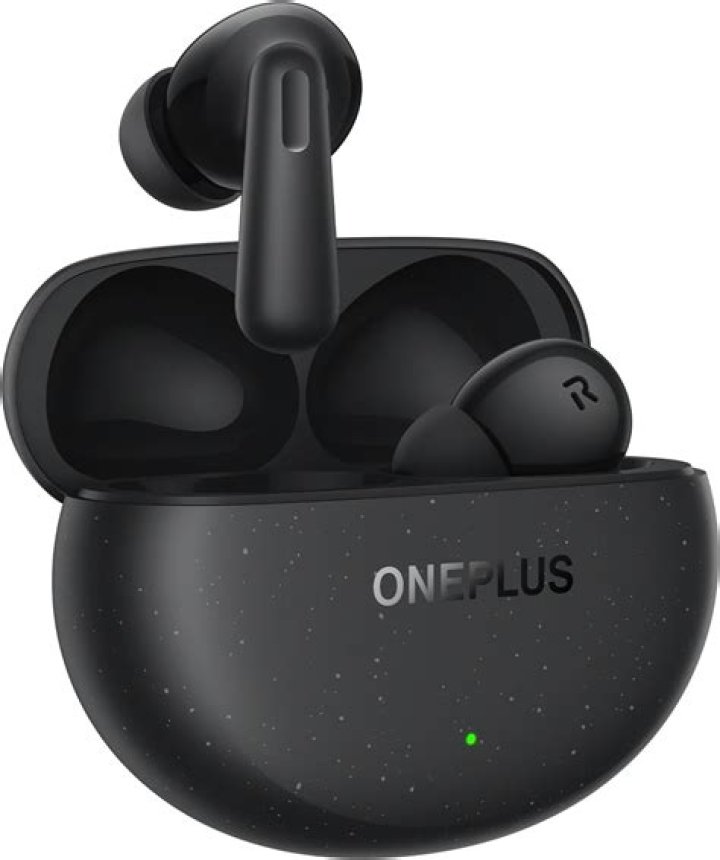 OnePlus Buds Pro in hand scaled 1 OnePlus Buds Pro in a person's hand in their case.