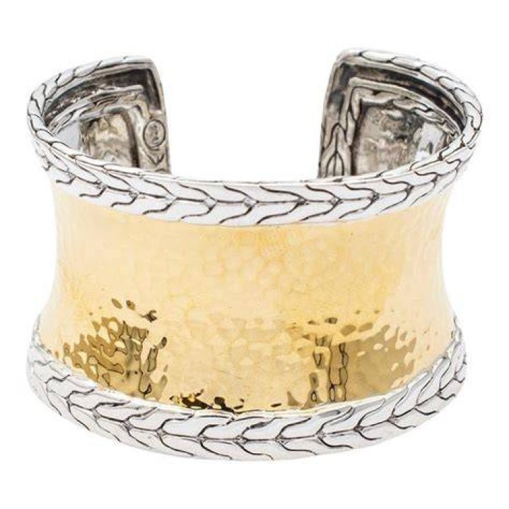 Shell and gold cuff bracelet.