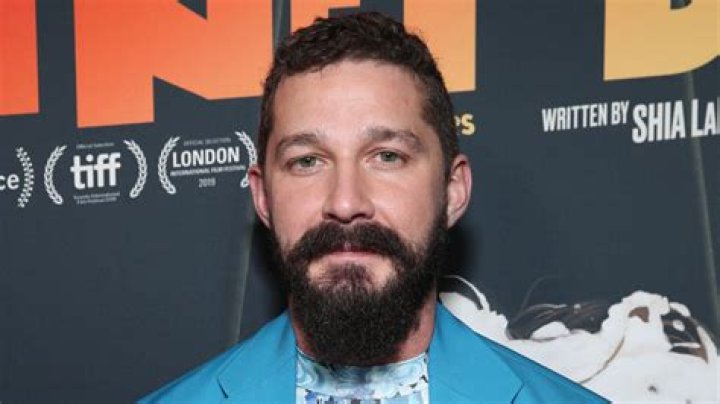 Shia LaBeouf posing in blue suit