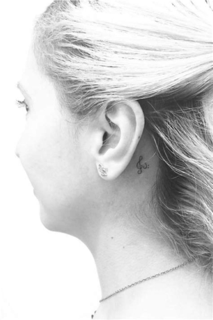 Small tattoos behind the ear