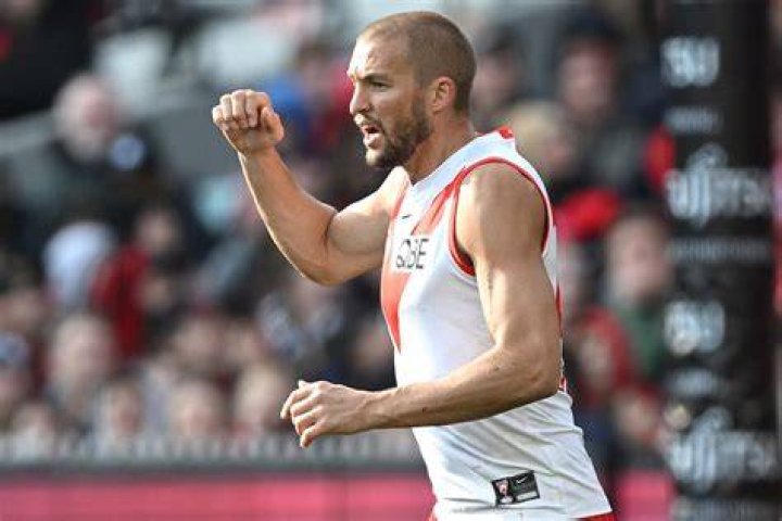 Sydney Swans player Sam Reid and his wife Kim celebrate their children