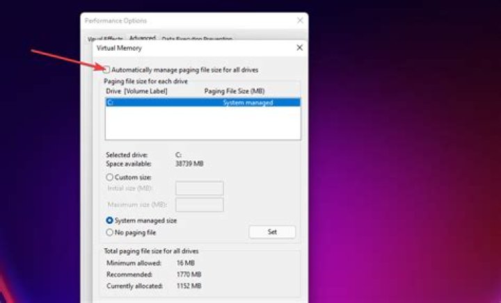The Automatically manage paging file size for all drives option The Automatically mange paging file size for all drives checkbox windows 11 keeps freezing