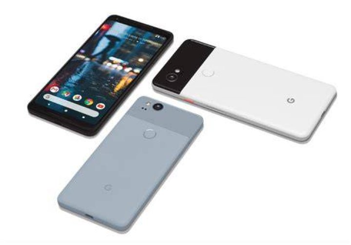 google pixel 2 and 2 xl review aa (14 of 19) The Google Pixel 2 and the Google Pixel 2 XL, side-by-side, face-up on a white desk.