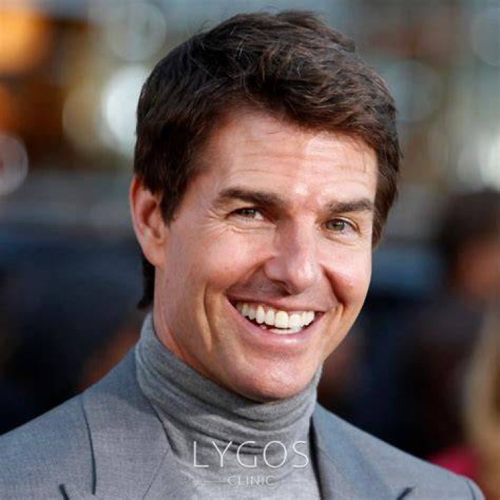 Tom Cruise smiling slightly